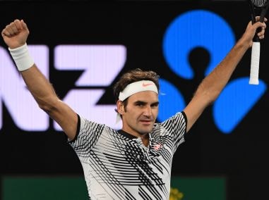 Roger Federer celebrates his victory against Mischa Zverev in their quarter-final. AFP