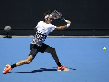 Roger Federer makes a backhand return during a practice session ahead of the Australian Open. AP