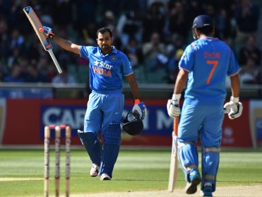 Rohit Sharma (L) and MS Dhoni. AFP