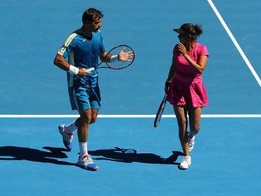 Sania Mirza and Ivan Dodig talk tactics against Samantha Stosur and Sam Groth of Australia in their mixed doubles semifinal match. Getty Images