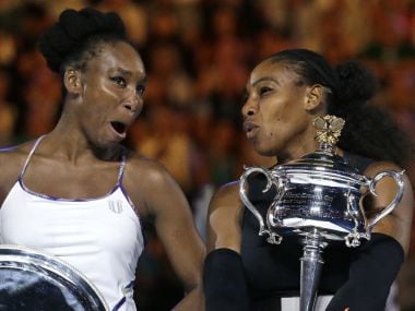 Venus Williams (L) and Serena Williams. AFP