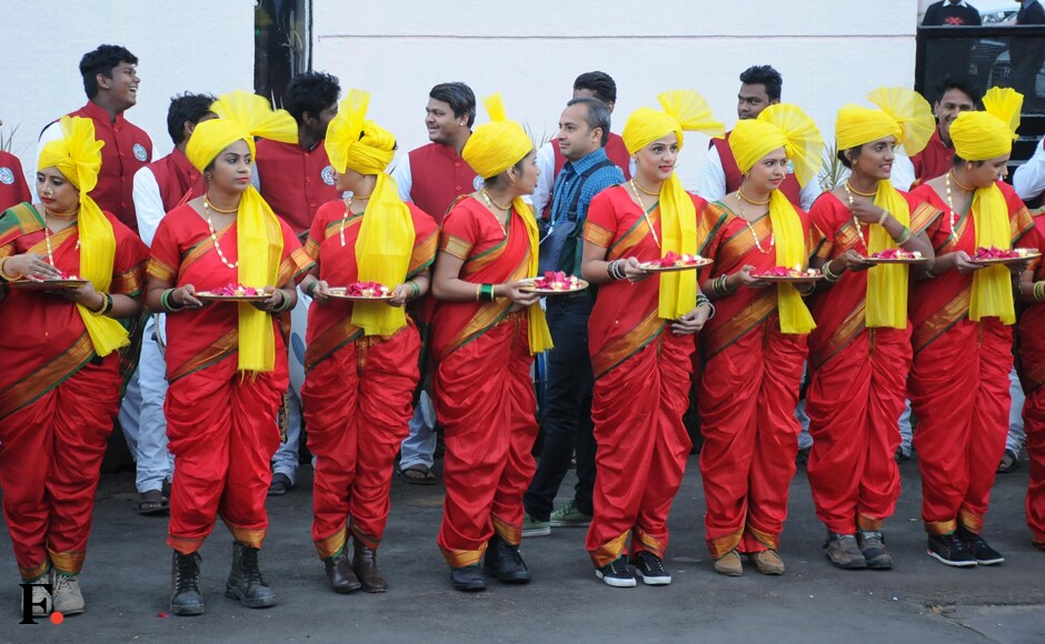 A host of young women, donning traditional red attire and yellow turbans, await the arrival of Vin Diesel and Deepika Padukone. Sachin Gokhale/Firstpost A host of young women, donning traditional red attire and yellow turbans, await the arrival of Vin Diesel and Deepika Padukone. Sachin Gokhale/Firstpost