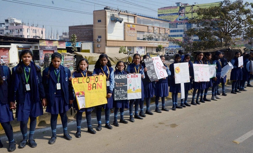 School students make a long human chain to support liquor prohibition. PTI