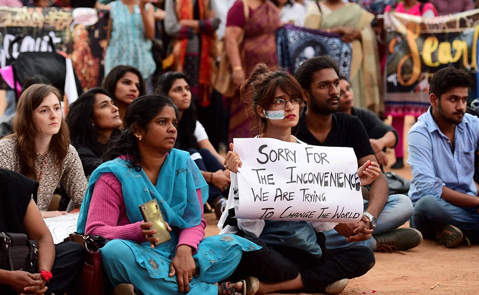 Protests were held in India as well. In this picture, activists hold placards at a protest against the newly sworn-in US President Donald Trump in Bengaluru. Photo: PTI Protests were held in India as well. In this picture, activists hold placards at a protest against the newly sworn-in US President Donald Trump in Bengaluru. Photo: PTI
