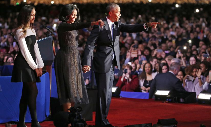 Barack Obama with wife Michelle and daughter Malia in Chicago. AP