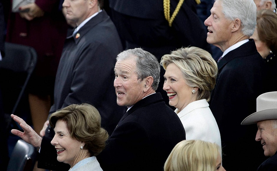 Dressed in an elegant powder white pant suit, designed by Ralph Lauren, Former Secretary of State Hillary Clinton appeared poignant and graceful as she watched the ceremony commences. AP Dressed in an elegant powder white pant suit, designed by Ralph Lauren, Former Secretary of State Hillary Clinton appeared poignant and graceful as she watched the ceremony commences. AP