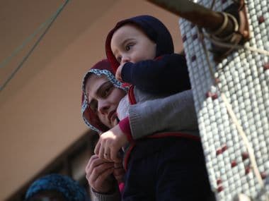 People watch the funeral of those killed during the shooting in Istanbul nightclub on New Year's day. AP