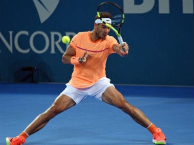 Nadal returns against Milos Raonic in their men's singles quarter-final in the Brisbane International. AFP