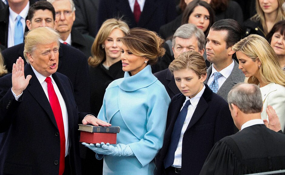 As scattered protests erupted elsewhere in Washington, Trump raised his right hand and put his left on a Bible used by Abraham Lincoln and repeated a 35-word oath of office from the U.S. Constitution, with U.S. Chief Justice John Roberts presiding. AP As scattered protests erupted elsewhere in Washington, Trump raised his right hand and put his left on a Bible used by Abraham Lincoln and repeated a 35-word oath of office from the U.S. Constitution, with U.S. Chief Justice John Roberts presiding. AP