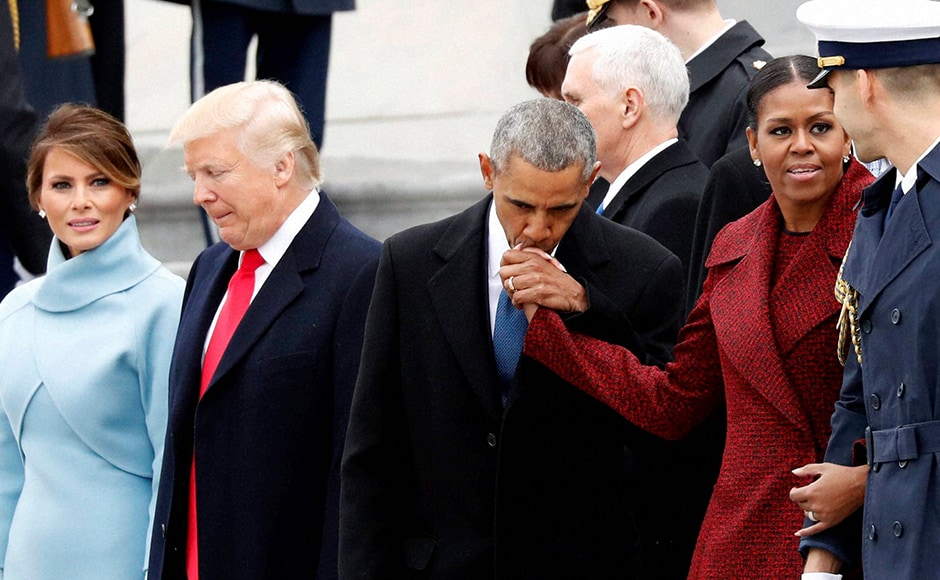 Barack Obama kisses Michelle Obama's hand during a departure ceremony on the East Front of the U.S. Capitol. AP Barack Obama kisses Michelle Obama's hand during a departure ceremony on the East Front of the U.S. Capitol. AP