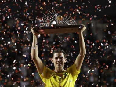 Dominic Thiem raises his trophy after defeating Pablo Carreno Busta in the final of the Rio Open. AP