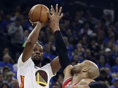 Golden State Warriors' Kevin Durant shoots over Chicago Bulls forward Taj Gibson. AP