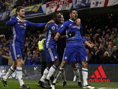 Chelsea's striker Diego Costa (R) celebrates with teammates after scoring. AFP
