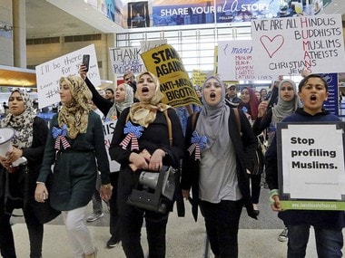 Demonstrators opposed to President Donald Trump's travel ban march through the Tom Bradley International Terminal at Los Angeles International Airport. AP