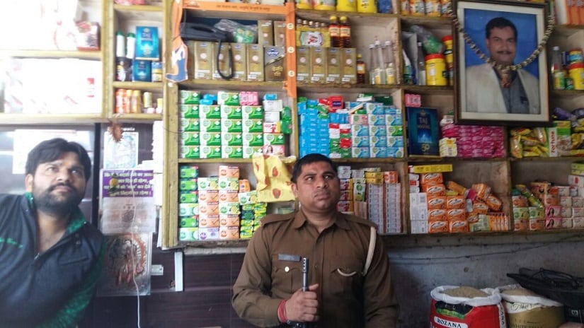 Hindu businessman Varun Singhal is provided with armed security to run his kirana store at Begumpura Bazar in Kairana, India. Firstpost/Tufail Ahmad
