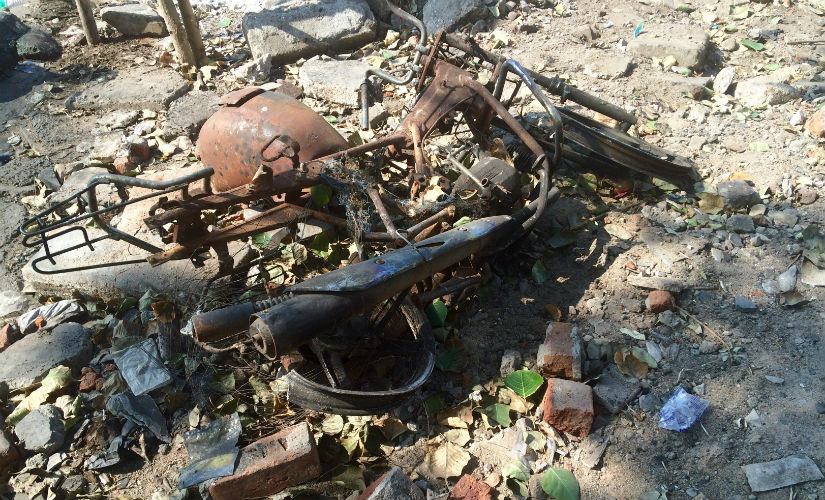 Burnt bikes are still scattered across what was the old fish market. Divya Karthikeyan