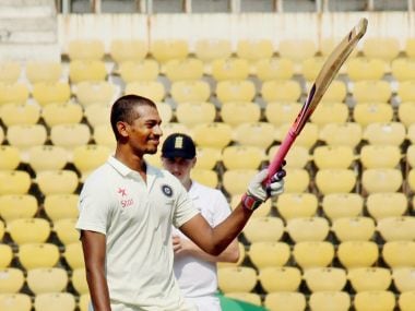 :India U-19 batsman Daryl S Ferrario raises his bat celebrates his century against England during the Test match at VCA stadium in Nagpur on Wednesday. PTI