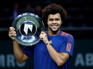 Jo-Wilfried Tsonga celebrates with the trophy after winning his match against David Goffin. Reuters