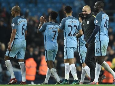 Pep Guardiola along with Manchester City players. AFP