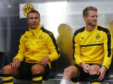 File photo of Borussia Dortmund's Mario Gotze and Andre Schurrle on the bench. Reuters