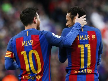 Barcelona's Lionel Messi talks to teammate Neymar after scoring their second goal. Reuters
