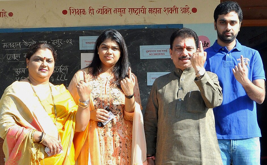 NCP MLA Hanumant Dolas with his family members display the indelible ink mark after casting vote for the municipal corporation election at Dasur village in Solapur, Maharashtra on Tuesday. PTI NCP MLA Hanumant Dolas with his family members display the indelible ink mark after casting vote for the municipal corporation election at Dasur village in Solapur, Maharashtra on Tuesday. PTI