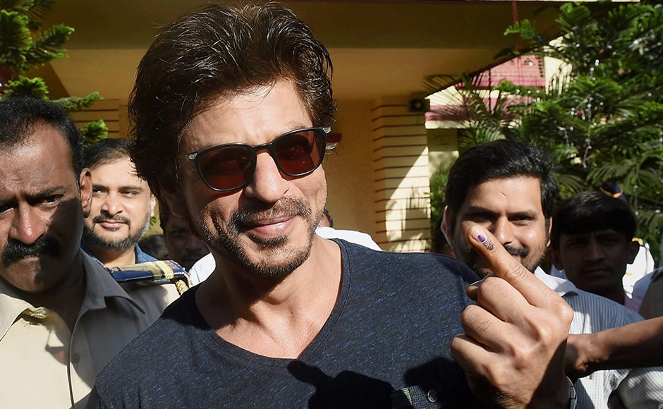 Bollywood superstar Shahrukh Khan shows his ink-marked finger after casting the vote for the Municipal Corporation election in Mumbai on Tuesday. PTI Bollywood superstar Shahrukh Khan shows his ink-marked finger after casting the vote for the Municipal Corporation election in Mumbai on Tuesday. PTI