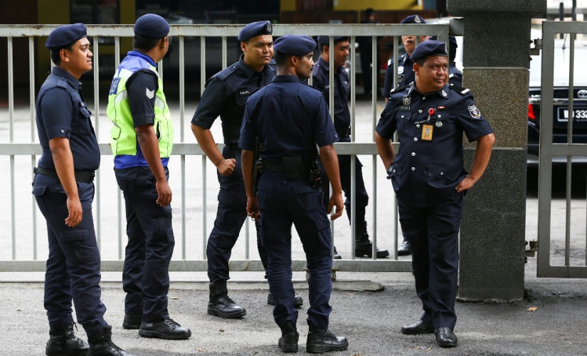 Malaysian police officers in front of the morgue at Kuala Lumpur General Hospital where Kim Jong Nam's body is held for autopsy. Reuters
