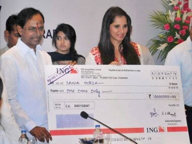 File photo of Telangana chief minister K Chandrashekhar Rao presenting a cheque Rs 1 crore to Sania Mirza. PTI