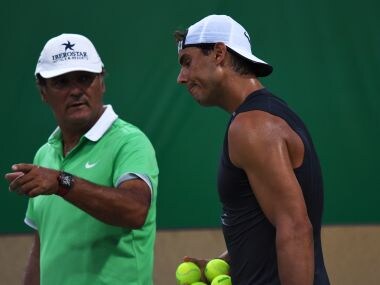 File photo of Rafael Nadal with his coach and uncle Toni Nadal. AFP