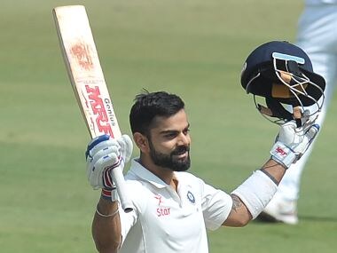 India's captain Virat Kohli raise his bat after scoring double century against Bangladesh. AFP