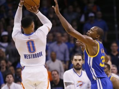 Oklahoma City Thunder guard Russell Westbrook shoots over Golden State Warriors forward Kevin Durant. AP