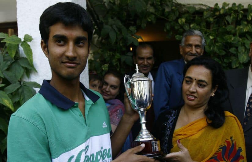 File photo of winner of 2009 Junior Australian Open Yuki Bhambri holding his trophy along with his mother Indu Bhambri. AFP
