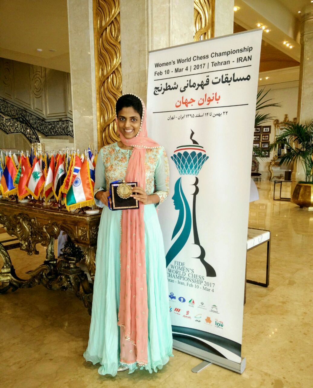 Harika with the World Women’s Chess Championship bronze medal and the Indian flag.