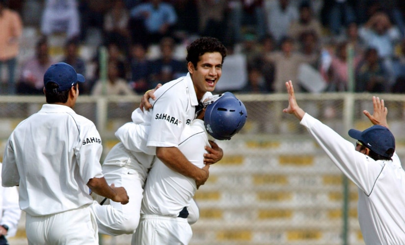 Irfan Pathan (C) celebrates with teammates after taking a hat-trick with the wicket of Pakistani batsman Mohammad Yousuf on the first day of the third and final Test against Pakistan in Karachi in 2006. AFP