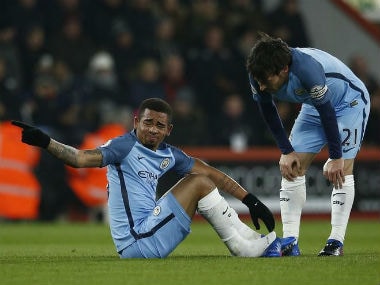 Manchester City's Gabriel Jesus (L) after sustaining an injury against Bournemouth. Reuters