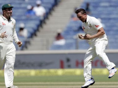 O'Keefe (R) celebrates the dismissal of Kohli during Day 3 of the Pune Test between India and Australia. AP