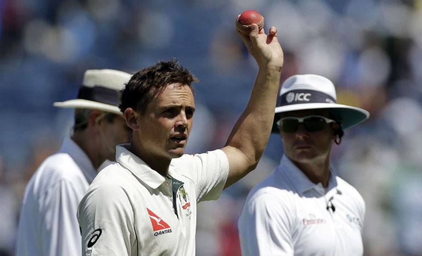 Steve O'Keefe celebrates his sixth wicket on the Day 2 of the first Test between India and Australia in Pune. AP