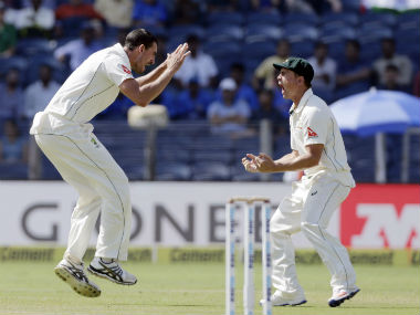 Starc, left and Handscomb celebrate the dismissal of India's captain Virat Kohli in the first Test at Pune. AP