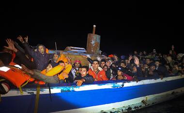 Plucked from the Mediterranean, over 400 migrants saved from a capsized dinghy off Libyan coast