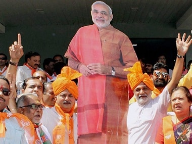 BJP supporters celebrating the party's victory in UP and Uttarakhand. PTI