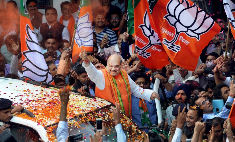 Amit Shah celebrates BJP's stunning win in Uttarakhand and Uttar Pradesh. PTI