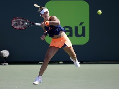 Angelique Kerber hits a return to Risa Ozaki during the Miami Open. Getty