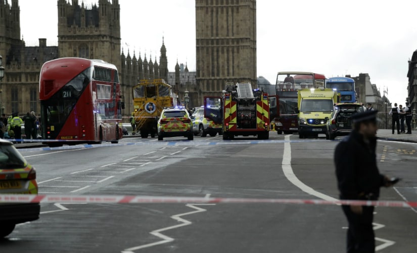 Police secure the area on the south side of Westminster Bridge close to the Houses of Parliament in London. AP