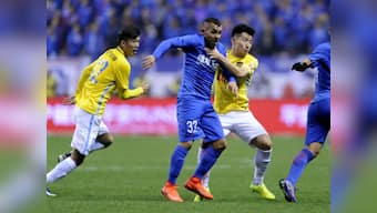 Chinese Super League: Carlos Tevez scores and sets up two on debut as Shanghai Shenhua beat Jiangsu Suning