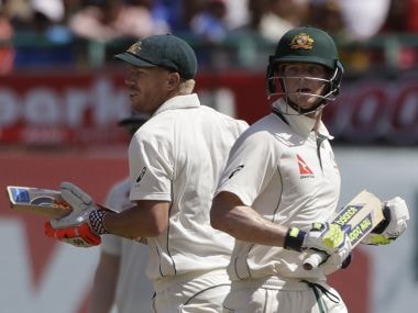 Australia's captain Steven Smith, right, and David Warner run between the wickets on Day 1. AP