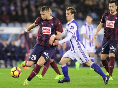Eibar's defender Florian Lejeune (L) vies with Real Sociedad's forward Juanmi Jimenez. AFP