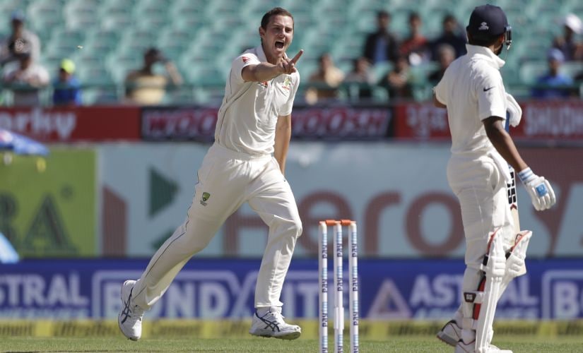 Australia's Josh Hazlewood celebrates the dismissal of India's Murali Vijay, right at Dharamsala. AP
