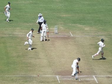 Virat Kohli looks back at his uprooted stumps during the Pune Test against Australia. AFP
