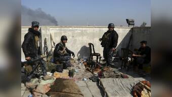 Iraqi forces seize third of west Mosul, Islamic State jihadists 'trapped'